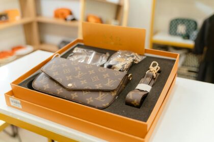 High-end Louis Vuitton monogram bag set displayed in a luxury boutique.