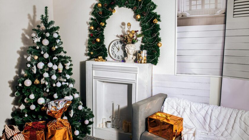 Cozy living room with a Christmas tree, gifts, and festive decor.